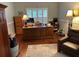 Charming office space featuring hardwood floors, plantation shutters, and an executive desk at 201 Asterbrooke Dr, Deland, FL 32724