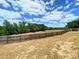 Large fenced in backyard with trees and green vegetation at 206 Westmoor Bnd, Orlando, FL 32835