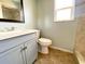 Bathroom featuring single sink vanity, toilet, and tiled shower at 206 Westmoor Bnd, Orlando, FL 32835