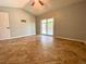 Spacious bedroom with tile flooring, sliding glass doors to the pool area, and ample space at 206 Westmoor Bnd, Orlando, FL 32835