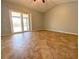 Bright bedroom with tile flooring and sliding glass doors leading to an outdoor patio and pool area at 206 Westmoor Bnd, Orlando, FL 32835
