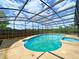 Enclosed swimming pool and spa with a screened enclosure at 206 Westmoor Bnd, Orlando, FL 32835
