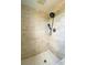 Walk-in shower featuring mosaic-patterned floors and wall tiles at 206 Westmoor Bnd, Orlando, FL 32835