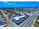 An aerial view shows this multi-unit apartment building and surrounding neighborhood with palms and tropical landscaping at 2101 N Atlantic Ave # 10, Daytona Beach, FL 32118
