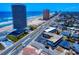 Real estate showing the beach, nearby road and property with parking and some landscaping at 2101 N Atlantic Ave # 10, Daytona Beach, FL 32118