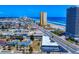 Daytona Beach, Florida, oceanfront property with ocean views, clear blue skies, and lush palm trees at 2101 N Atlantic Ave # 10, Daytona Beach, FL 32118
