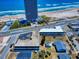 Real estate showing the building's parking lot, nearby beach, and surrounding landscaping at 2101 N Atlantic Ave # 10, Daytona Beach, FL 32118