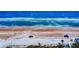 Aerial shot capturing sandy beach, clear blue ocean waters, blue skies, and various vehicles at 2101 N Atlantic Ave # 10, Daytona Beach, FL 32118