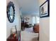 Inviting hallway offers a glimpse into the carpeted living room at 2101 N Atlantic Ave # 10, Daytona Beach, FL 32118