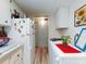 Cozy kitchen featuring white cabinets, modern appliances, and decor at 2101 N Atlantic Ave # 10, Daytona Beach, FL 32118