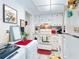 The well-lit kitchen features white cabinets and appliances at 2101 N Atlantic Ave # 10, Daytona Beach, FL 32118