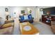 Inviting living room featuring a comfortable sofa, TV, and open access to the dining area at 2101 N Atlantic Ave # 10, Daytona Beach, FL 32118