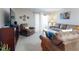 Comfortable living room with a TV, recliner, and sofa, featuring ample natural light and cozy decor at 2101 N Atlantic Ave # 10, Daytona Beach, FL 32118