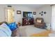 Spacious living room with comfortable seating, entertainment center, and stylish decor at 2101 N Atlantic Ave # 10, Daytona Beach, FL 32118