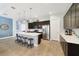 Bright kitchen with a large island, pendant lighting, stainless steel appliances and dark wood cabinetry at 220 Asterbrooke Dr, Deland, FL 32724