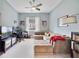 Cozy living room with a large sectional sofa and desk area at 220 Asterbrooke Dr, Deland, FL 32724