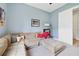 Cozy living room with a large sectional sofa, soft carpet, and natural light at 220 Asterbrooke Dr, Deland, FL 32724