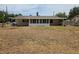 Rear of house with screened porch and large backyard at 2204 Poinsettia Dr, Deland, FL 32724