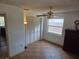 Bright bedroom featuring a ceiling fan, spacious closet, and natural light from a window at 2204 Poinsettia Dr, Deland, FL 32724