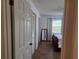 View into bedroom with closet and mirror; neutral color palette and natural light at 2204 Poinsettia Dr, Deland, FL 32724