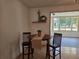 Cozy dining area with tile flooring and a view into the sunroom, creating a bright atmosphere at 2204 Poinsettia Dr, Deland, FL 32724
