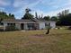 Charming single-story home with landscaped front yard and a welcoming porch at 2204 Poinsettia Dr, Deland, FL 32724