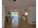 Spacious living room featuring tile flooring, a dining area, and an open view to the kitchen at 2204 Poinsettia Dr, Deland, FL 32724