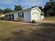 Well-maintained home exterior features a garage, manicured landscaping, and a freshly painted exterior at 2204 Poinsettia Dr, Deland, FL 32724