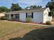 Well-maintained home exterior features a garage, manicured landscaping, and a freshly painted exterior at 2204 Poinsettia Dr, Deland, FL 32724