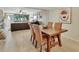 Open-concept dining room with views to the Gathering room and fireplace at 2329 River Ridge Rd # 4, Deland, FL 32720