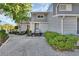 Charming gray townhouse featuring a landscaped front yard and inviting front entrance at 2329 River Ridge Rd # 4, Deland, FL 32720