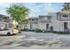 A row of gray townhouses with well-maintained landscaping in a peaceful neighborhood setting at 2329 River Ridge Rd # 4, Deland, FL 32720