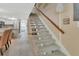 Hallway featuring wood-look floors and a carpeted staircase to the second floor at 2329 River Ridge Rd # 4, Deland, FL 32720