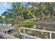Scenic waterfront view showcases a calm waterway, natural landscaping, and a docked boat with a green cover at 2329 River Ridge Rd # 4, Deland, FL 32720