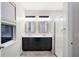 Bright bathroom features double sinks, modern vanity and glass shower at 2406 Kennington Cv, Deland, FL 32724