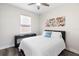 Bright bedroom features a comfortable bed, beach accents, and a modern desk, creating a relaxing space at 2406 Kennington Cv, Deland, FL 32724