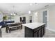 Open kitchen and dining area with an island and pendant lighting at 2406 Kennington Cv, Deland, FL 32724