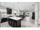 Open kitchen featuring dark cabinets, white countertops, and view to living space at 2406 Kennington Cv, Deland, FL 32724