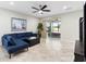 Cozy living room with tile floors, sliding glass doors, and contemporary decor at 2406 Kennington Cv, Deland, FL 32724