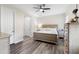 Serene main bedroom with wood floors, neutral tones, and natural light at 2406 Kennington Cv, Deland, FL 32724
