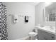 Bathroom featuring a gray vanity with a shower and modern accents at 2448 Newmark Dr, Deltona, FL 32738