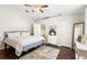 Comfortable bedroom featuring a bed with wood laminate flooring and a ceiling fan at 2448 Newmark Dr, Deltona, FL 32738
