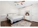 Comfortable bedroom featuring a bed with wood laminate flooring and a ceiling fan at 2448 Newmark Dr, Deltona, FL 32738