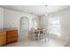 Cozy dining area featuring white and wood bar-height chairs and neutral paint with tile flooring at 2448 Newmark Dr, Deltona, FL 32738