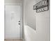 Inviting entryway with a white front door and decorative wall accents at 2448 Newmark Dr, Deltona, FL 32738