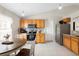 Eat-in kitchen with granite countertops, stainless steel appliances, and tile flooring at 2448 Newmark Dr, Deltona, FL 32738