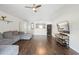 Hardwood floors and vaulted ceilings accentuate this open-concept living room, perfect for entertaining at 2448 Newmark Dr, Deltona, FL 32738