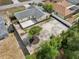 Aerial view of the property showcasing a spacious backyard, patio, and mature trees at 2486 Shiprock Ct, Deltona, FL 32738