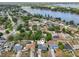 Aerial view showcasing the property's location near a picturesque lake and residential neighborhood at 2486 Shiprock Ct, Deltona, FL 32738