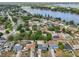 Aerial view showcasing the property's location near a picturesque lake and residential neighborhood at 2486 Shiprock Ct, Deltona, FL 32738